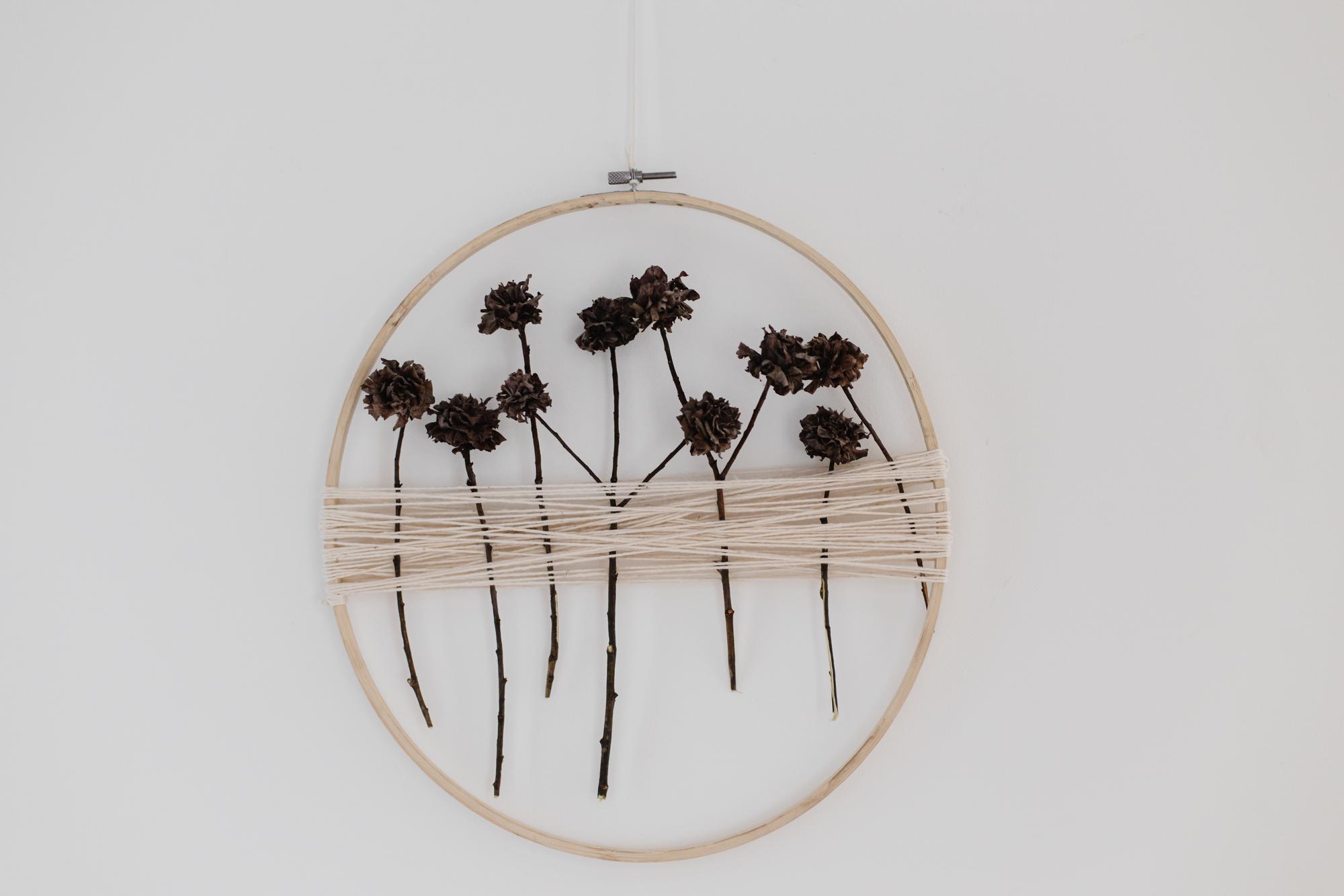 Wall hanging embroidered with floral motif